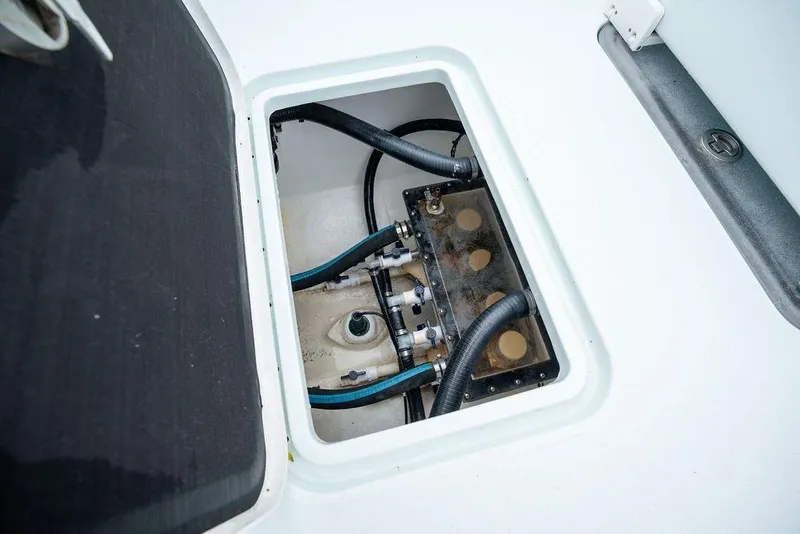Slide: The Image of Hatch interior of 2019 Conch 33 boat showing hoses and fittings. - 43