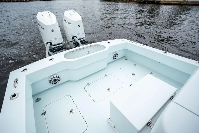 Slide: The Image of 2019 Conch 33 boat with twin Mercury outboard engines on water. - 37