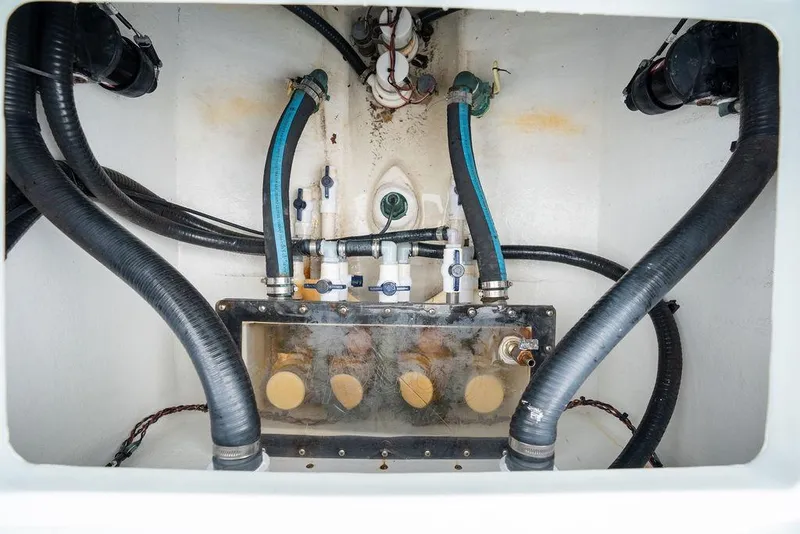 Slide: The Image of Bilge compartment of 2019 Conch 33 boat with hoses and valves. - 42