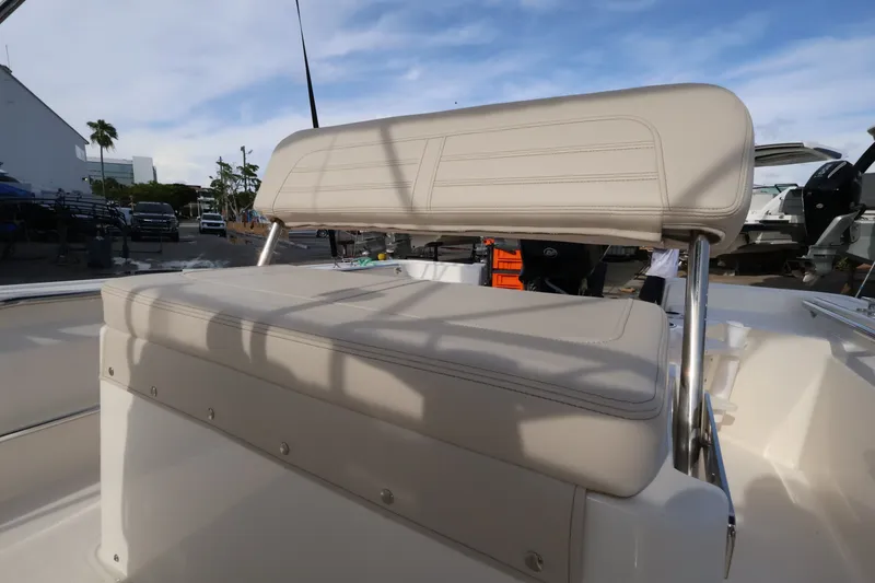 Slide: The Image of The 2027 Boston Whaler 150 Montauk features a cushioned bench seat with stainless steel supports. - 8