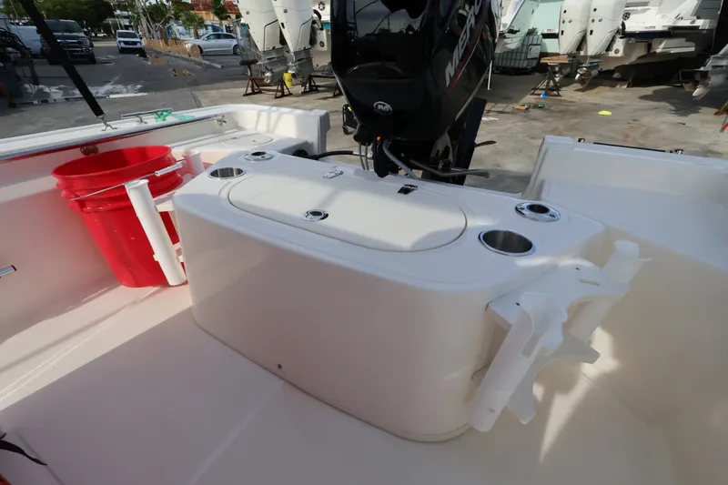 Slide: The Image of The image shows the cockpit of a Boston Whaler 150 Montauk with an outboard motor. - 7