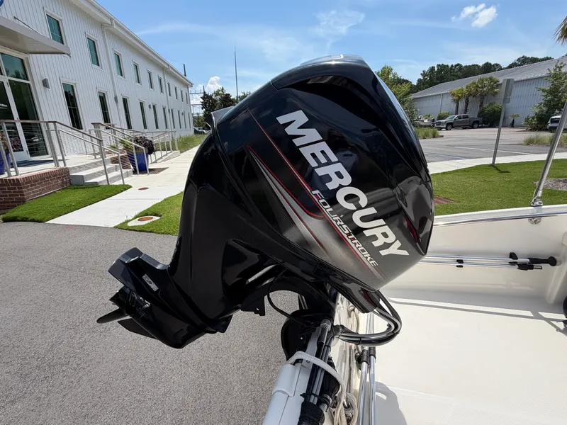 Slide: The Image of A Mercury outboard motor is mounted on a 2018 Boston Whaler 130 Super Sport. - 4