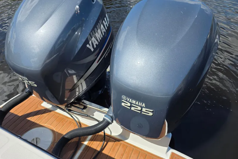Slide: The Image of Twin Yamaha 225 outboard engines on a 2002 Regulator 26 Center Console boat. - 23