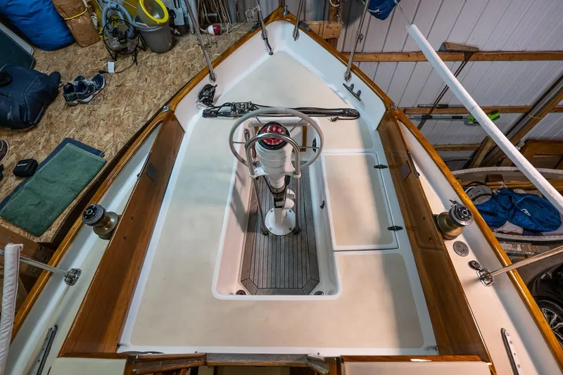 Slide: The Image of Cockpit of a 1981 Morris Yachts Leigh 30 sailboat, featuring a central steering wheel. - 8