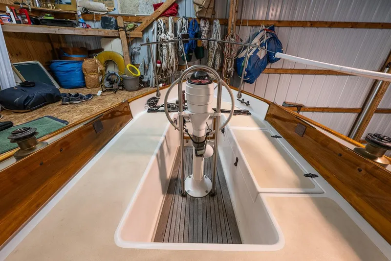 Slide: The Image of Interior view of a 1981 Morris Yachts Leigh 30 sailboat, showcasing the cockpit and steering wheel. - 9