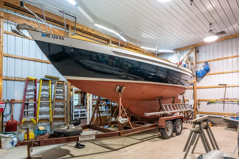 Slide: The Image of 1981 Morris Yachts Leigh 30 sailboat on trailer in a workshop. - 27