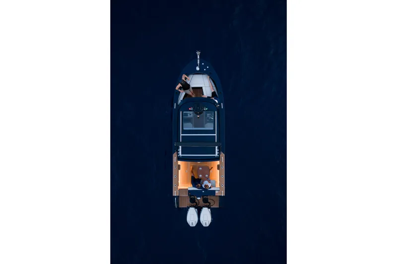 Slide: The Image of Aerial view of 2026 Jasper Marine Defender 22 boat on dark water. - 4
