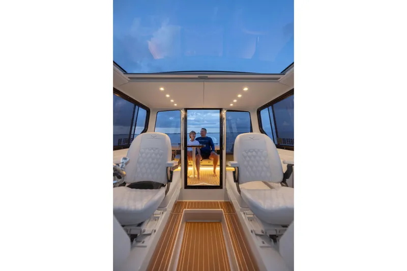 Slide: The Image of Interior view of 2026 Jasper Marine Defender 22 boat, featuring luxurious seating and modern design. - 2