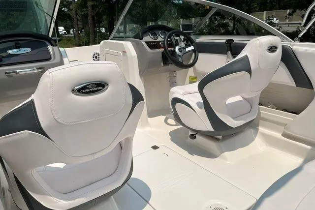 Slide: The Image of Interior of 2021 Chaparral 19 SSi OB boat with white seating and steering console. - 11