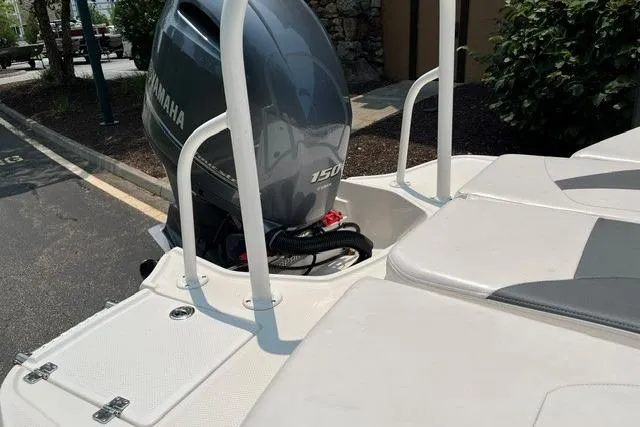 Slide: The Image of 2021 Chaparral 19 SSi OB boat with Yamaha 150 outboard motor, rear view. - 9