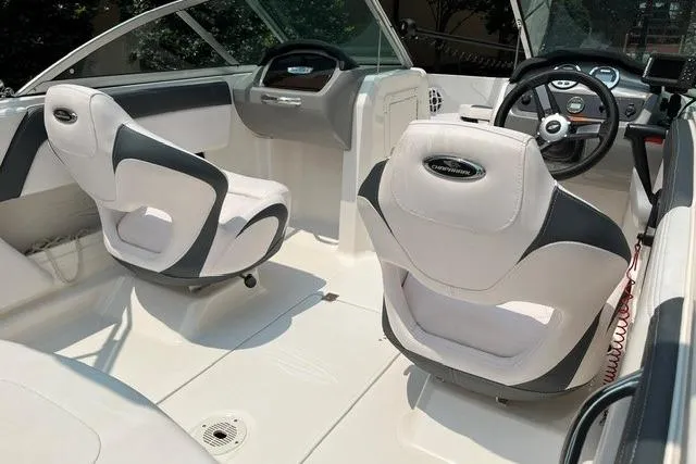 Slide: The Image of Interior of 2021 Chaparral 19 SSi OB boat with modern seating and steering wheel. - 6