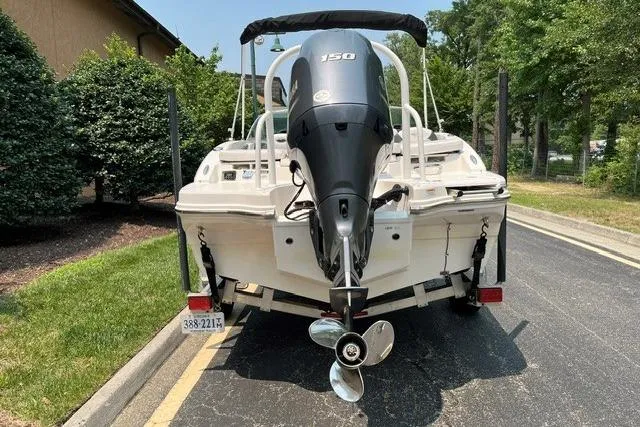Slide: The Image of 2021 Chaparral 19 SSi OB boat with Yamaha 150 outboard motor on trailer. - 3