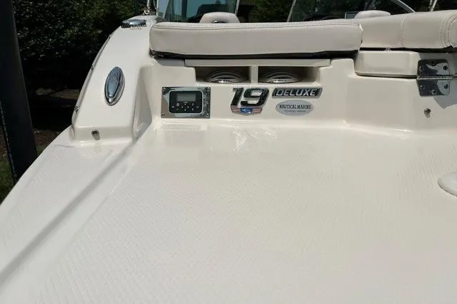 Slide: The Image of 2021 Chaparral 19 SSi OB boat deck with deluxe badge and seating area. - 10