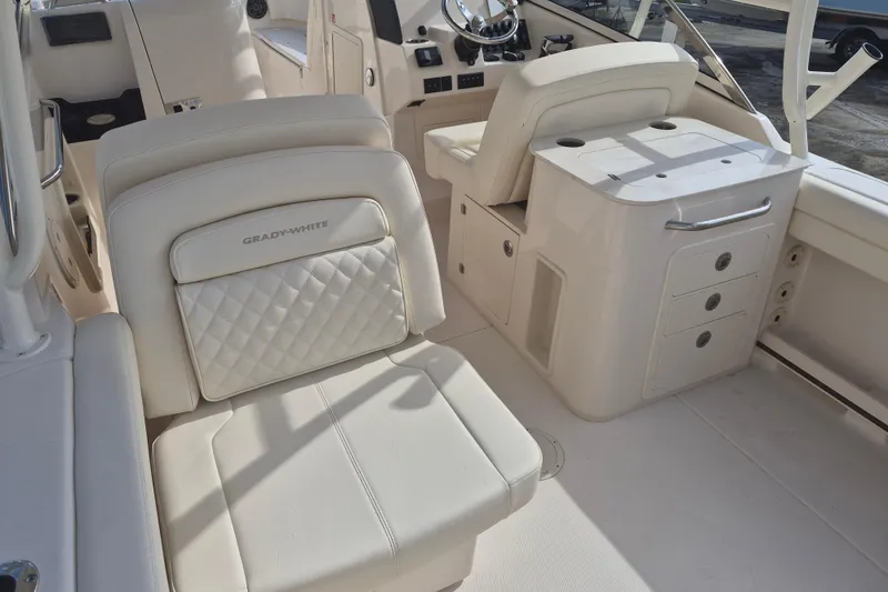 Slide: The Image of Interior of 2026 Grady-White Freedom 275 boat with luxurious seating and helm station. - 12