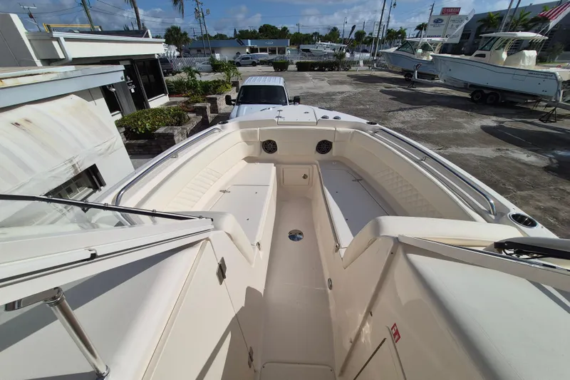 Slide: The Image of 2026 Grady-White Freedom 275 boat interior, showcasing spacious seating and sleek design. - 5