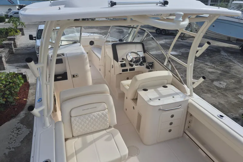 Slide: The Image of 2026 Grady-White Freedom 275 boat interior with helm, seating, and storage compartments. - 3