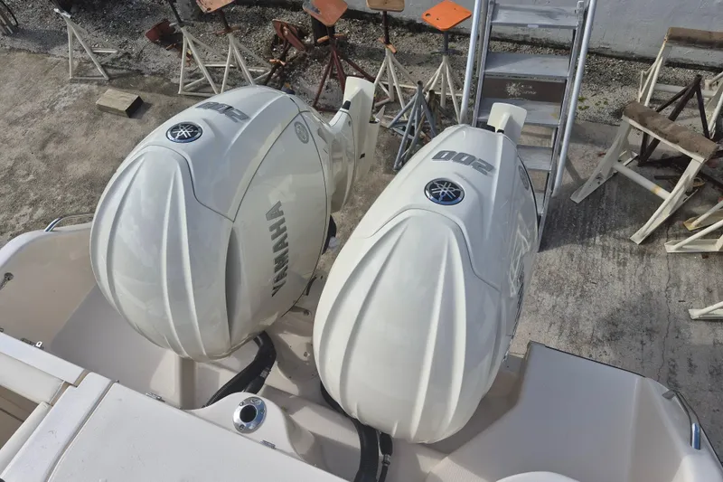 Slide: The Image of 2026 Grady-White Freedom 275 boat with twin Yamaha outboard engines, viewed from above. - 15