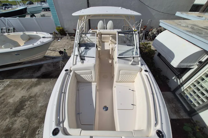 Slide: The Image of 2026 Grady-White Freedom 275 boat, aerial view, docked outdoors. - 2