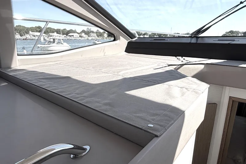 Slide: The Image of Interior view of 2017 Sea Ray Sundancer 460 yacht with scenic marina backdrop. - 43