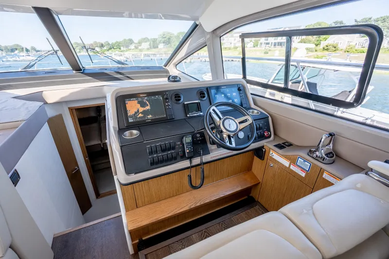 Slide: The Image of Interior helm of 2017 Sea Ray Sundancer 460 yacht with modern navigation controls. - 39