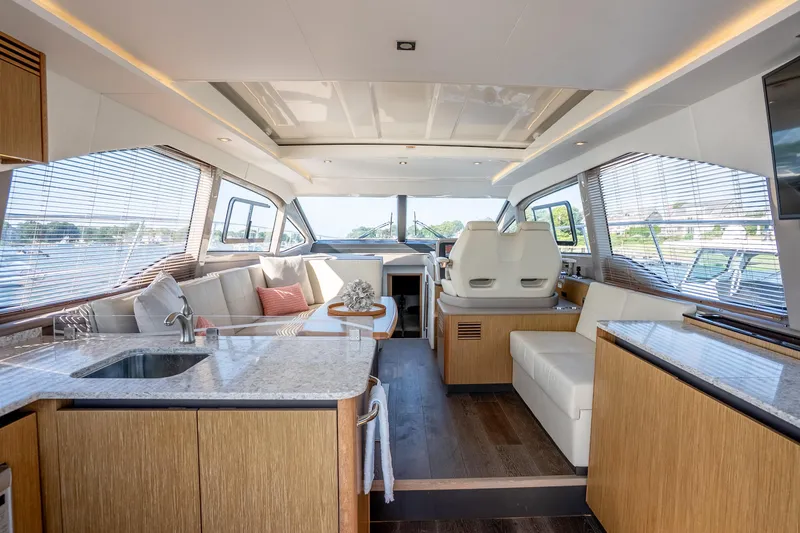 Slide: The Image of Luxurious interior of 2017 Sea Ray Sundancer 460 yacht with modern kitchen and seating area. - 31