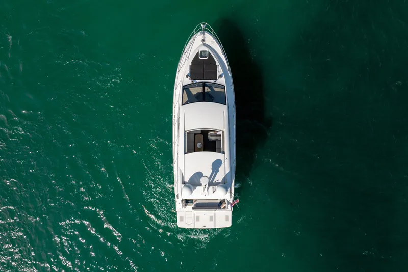 Slide: The Image of Aerial view of 2017 Sea Ray Sundancer 460 yacht on clear green water. - 14