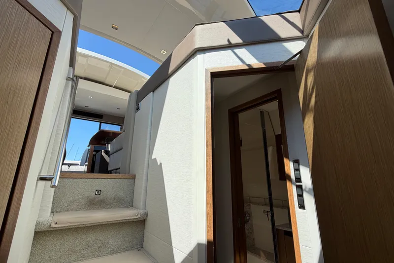 Slide: The Image of Interior view of 2017 Sea Ray Sundancer 460 yacht, featuring stairs and modern design elements. - 31