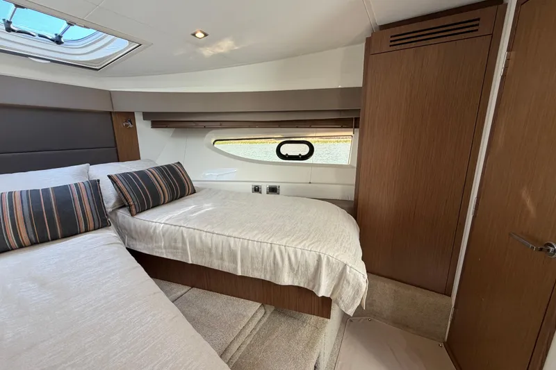 Slide: The Image of Interior cabin of 2017 Sea Ray Sundancer 460 yacht with cozy bedding and window view. - 34