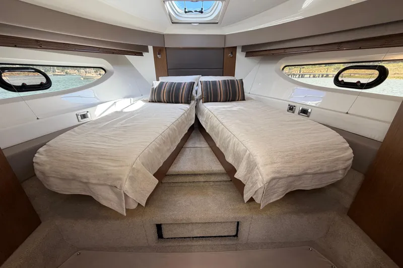 Slide: The Image of Luxurious 2017 Sea Ray Sundancer 460 cabin with twin beds and scenic windows. - 33