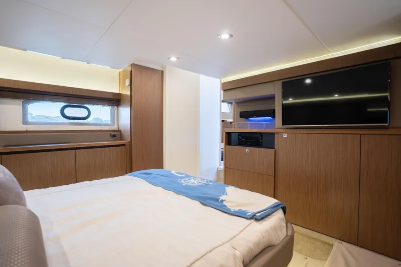 Slide: The Image of Luxurious interior of 2017 Sea Ray Sundancer 460 yacht with modern wood finishes and TV. - 59