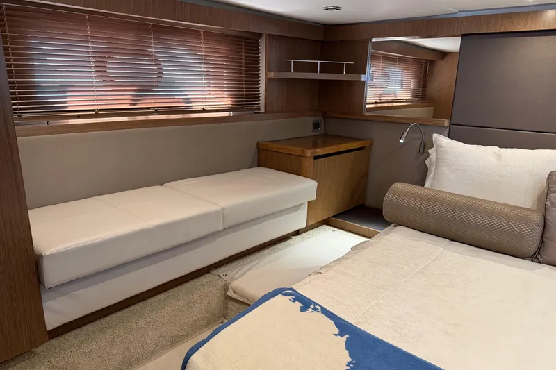 Slide: The Image of Luxurious interior of 2017 Sea Ray Sundancer 460 yacht with elegant seating and bedding. - 39