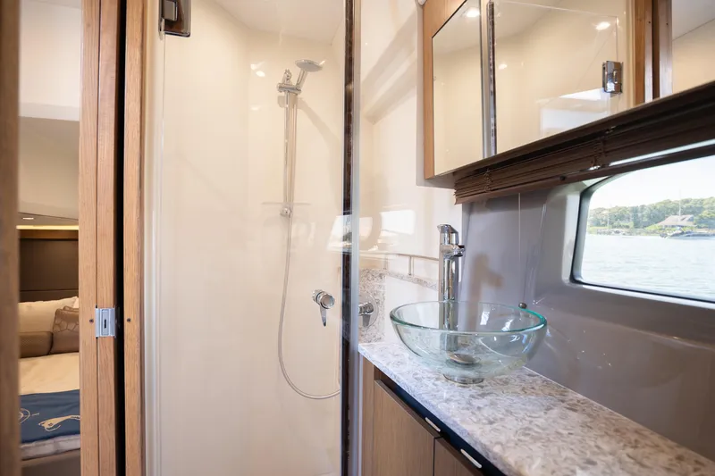 Slide: The Image of Luxurious bathroom in 2017 Sea Ray Sundancer 460 yacht with glass sink and shower. - 65