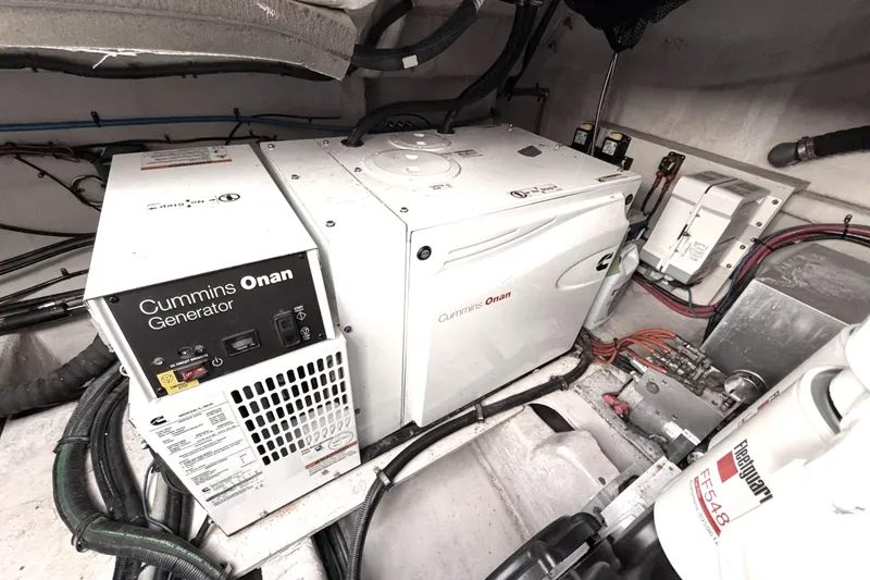 Slide: The Image of Cummins Onan generator in 2017 Sea Ray Sundancer 460 engine room, showcasing marine equipment. - 68