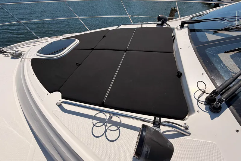 Slide: The Image of 2017 Sea Ray Sundancer 460 yacht deck with black sunpad, ocean view. - 8