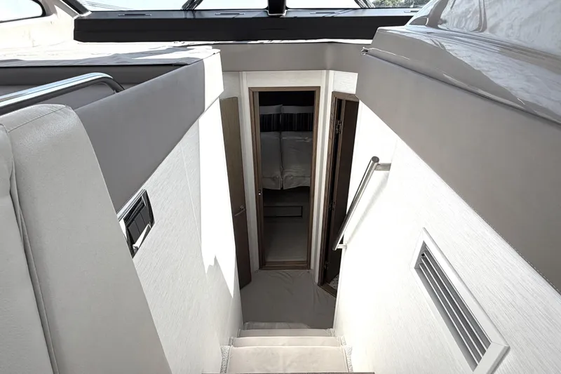 Slide: The Image of Interior view of 2017 Sea Ray Sundancer 460 yacht, featuring stairs leading to cabin. - 44