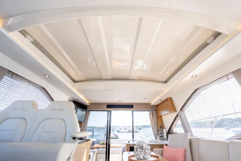 Slide: The Image of Luxurious interior of 2017 Sea Ray Sundancer 460 yacht with panoramic windows and elegant seating. - 37