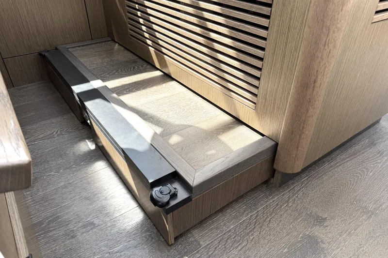 Slide: The Image of Wooden interior detail of 2017 Sea Ray Sundancer 460 yacht, featuring a step and vented panel. - 41