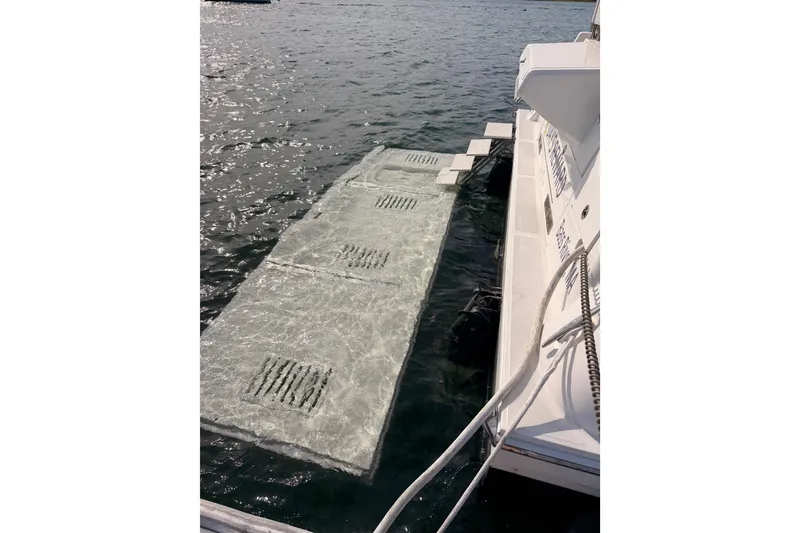Slide: The Image of 2017 Sea Ray Sundancer 460 yacht with submerged swim platform in water. - 25