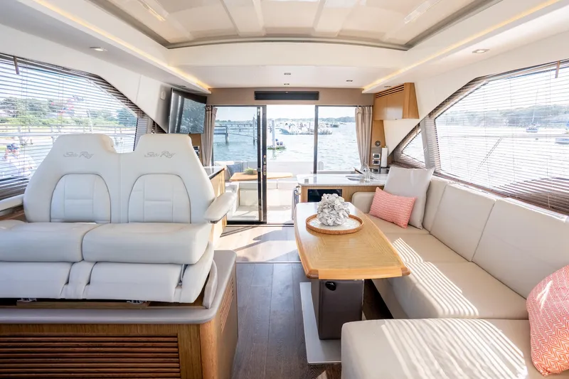 Slide: The Image of Luxurious interior of 2017 Sea Ray Sundancer 460 yacht with elegant seating and scenic views. - 35