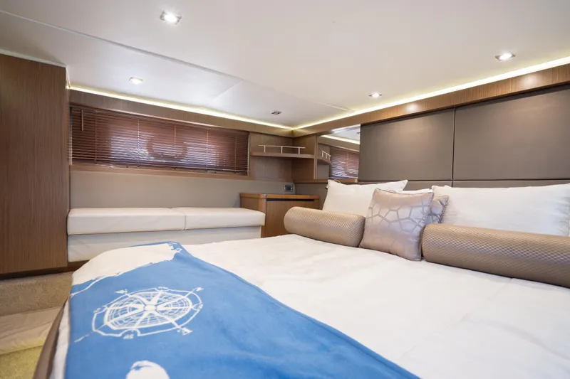 Slide: The Image of Luxurious interior of 2017 Sea Ray Sundancer 460 yacht bedroom with modern decor. - 58