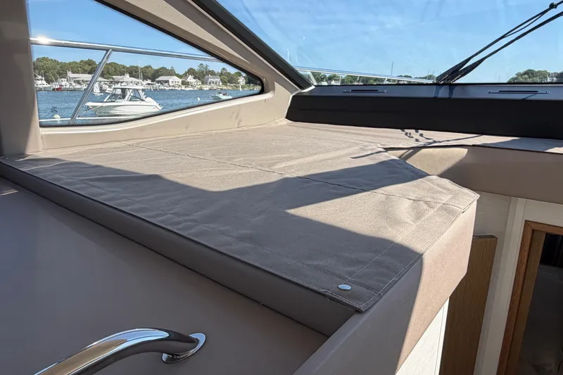 Slide: The Image of Interior view of 2017 Sea Ray Sundancer 460 yacht with scenic marina backdrop. - 27