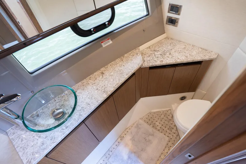 Slide: The Image of Luxurious bathroom in 2017 Sea Ray Sundancer 460 yacht with modern fixtures and elegant design. - 64