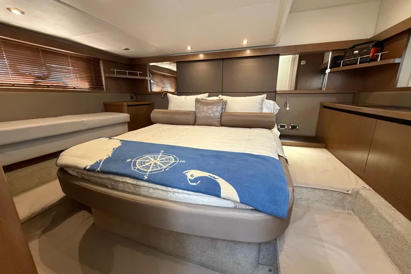 Slide: The Image of Luxurious 2017 Sea Ray Sundancer 460 cabin with elegant bedding and modern decor. - 38