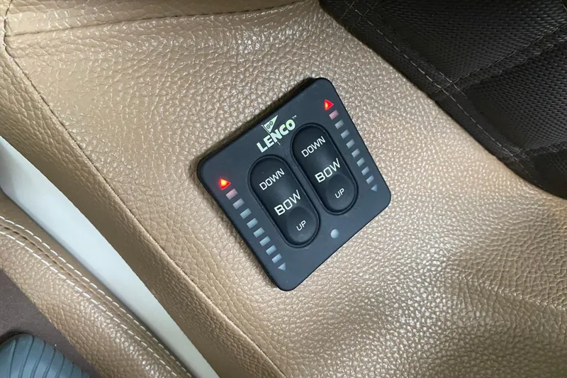 Slide: The Image of Lenco trim tab control on 2015 Cobalt 336 boat, beige leather interior. - 34