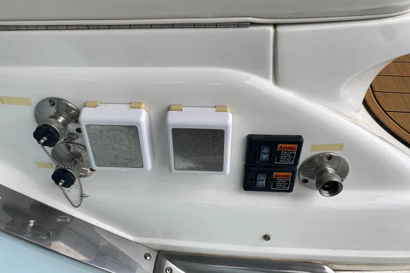 Slide: The Image of Electrical and water connections on a 2015 Cobalt 336 boat. - 52