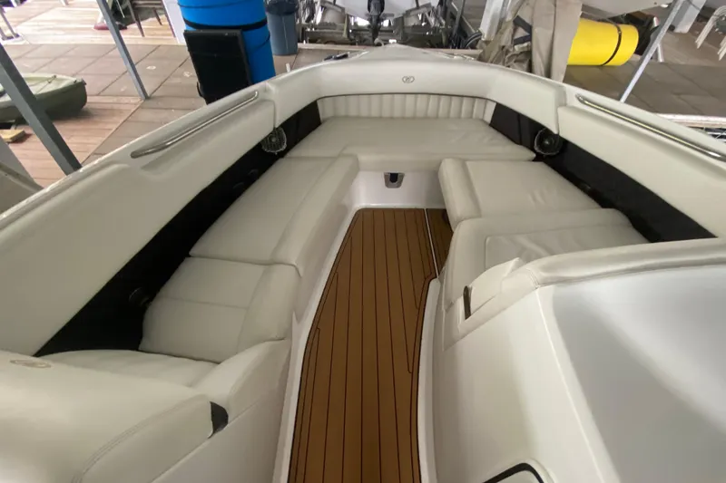 Slide: The Image of Luxurious interior of a 2015 Cobalt 336 boat with white seating and wooden flooring. - 36