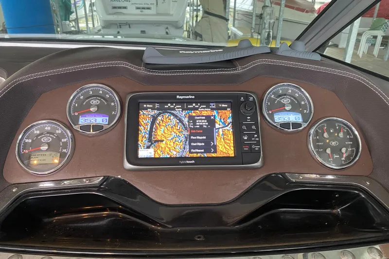 Slide: The Image of Dashboard of a 2015 Cobalt 336 boat with navigation system and gauges. - 27