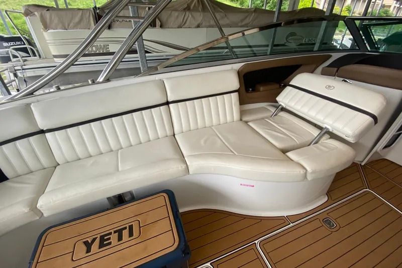Slide: The Image of Luxurious seating on a 2015 Cobalt 336 boat with teak flooring and Yeti cooler. - 22