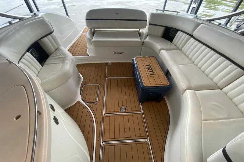 Slide: The Image of Luxurious interior of 2015 Cobalt 336 boat with white seating and teak flooring. - 17