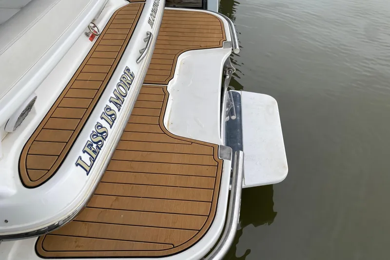 Slide: The Image of 2015 Cobalt 336 boat with teak swim platform, "Less is More" text. - 14